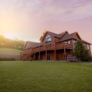 brown-wooden-house-with-green-grass-field-bkp3glygyea
